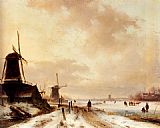 Winter a huntsman passing woodmills on a snowy track, skaters on a frozen river beyond by Andreas Schelfhout